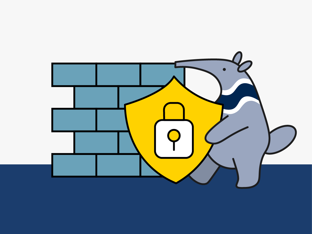 Peter the anteater holding a sign with a locked lock on it in front of a blue brick wall