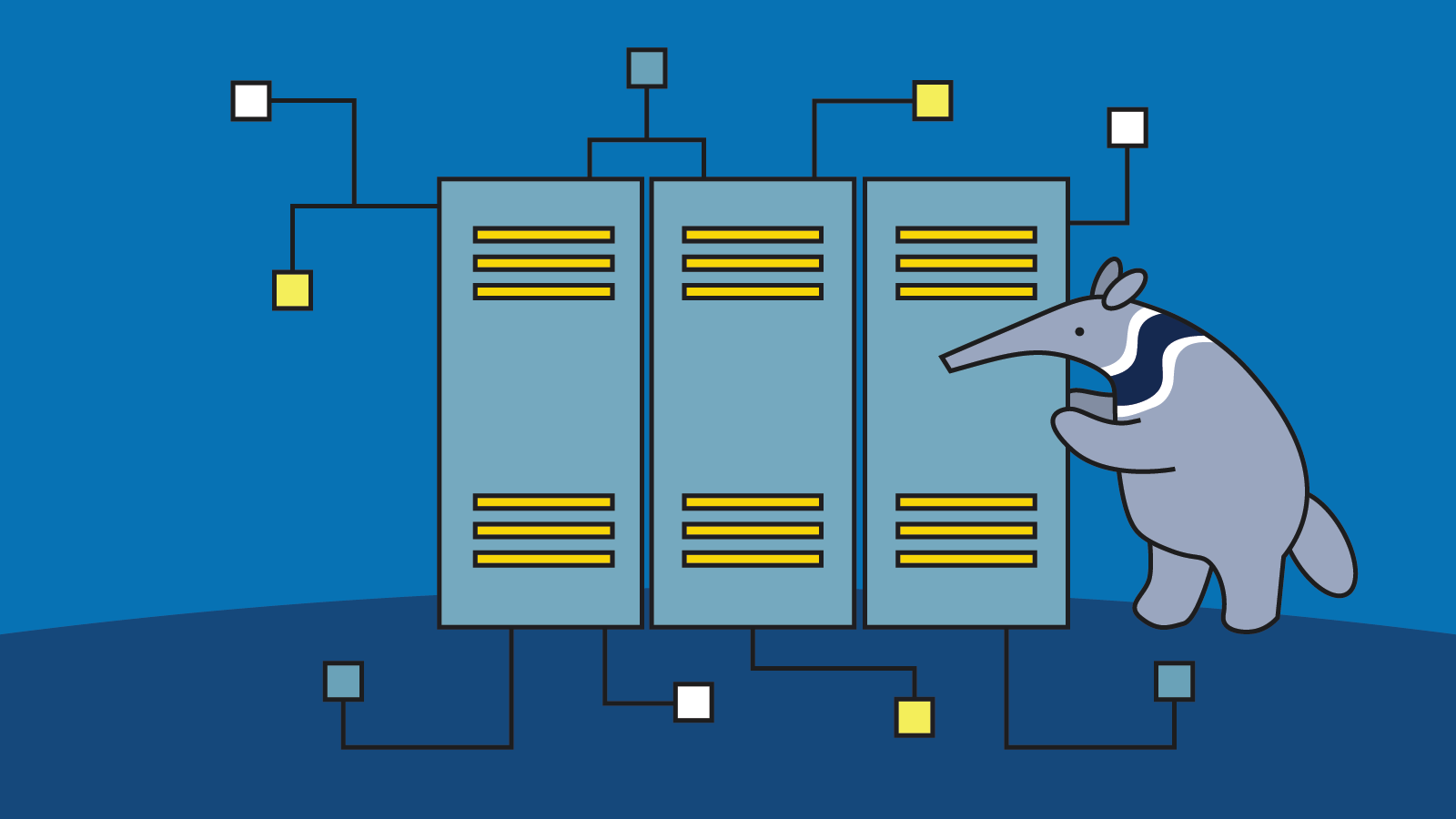 Peter the anteater standing next to servers in a server room.